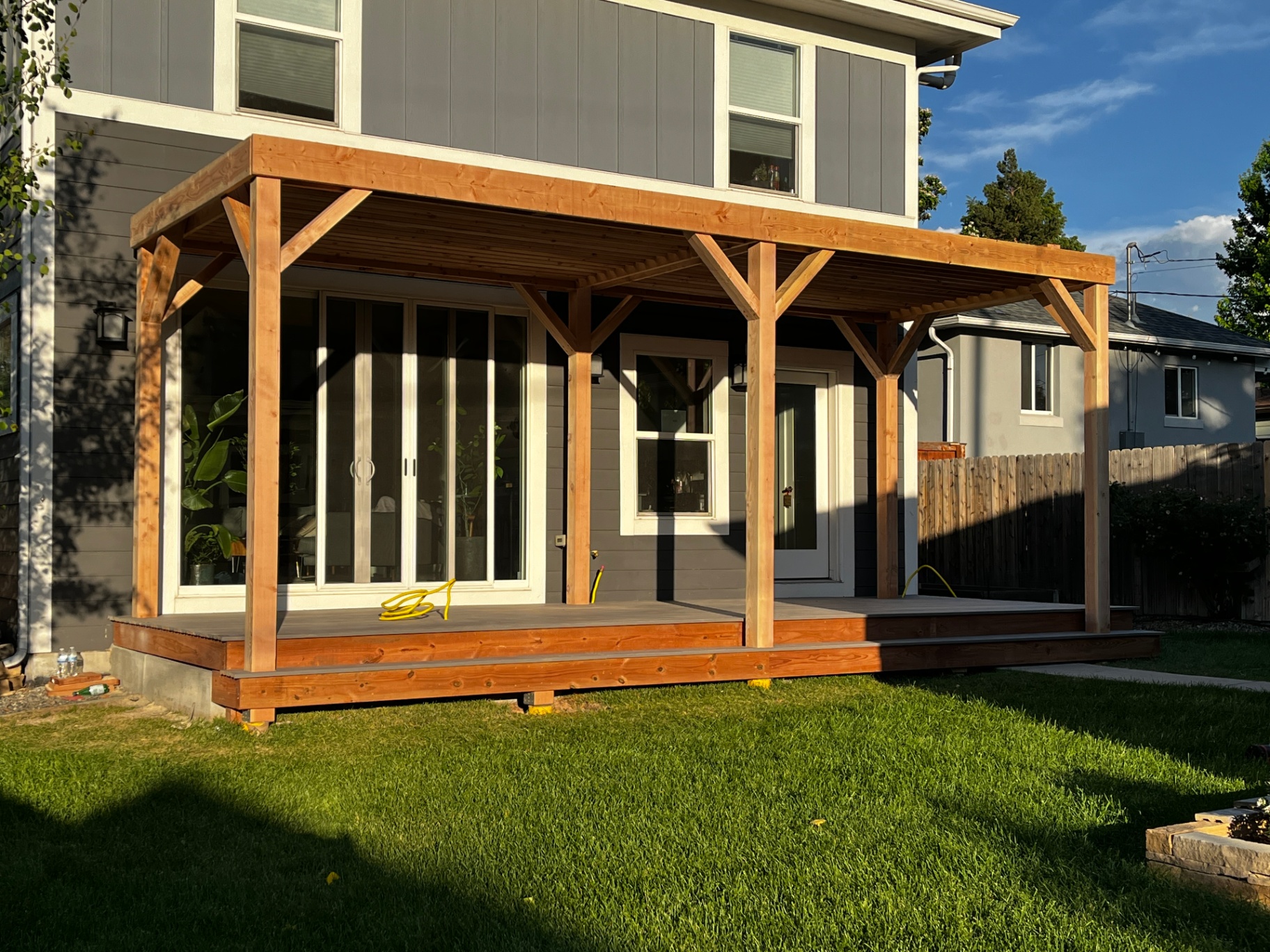 Completed cedar covered deck with timber posts and brackets