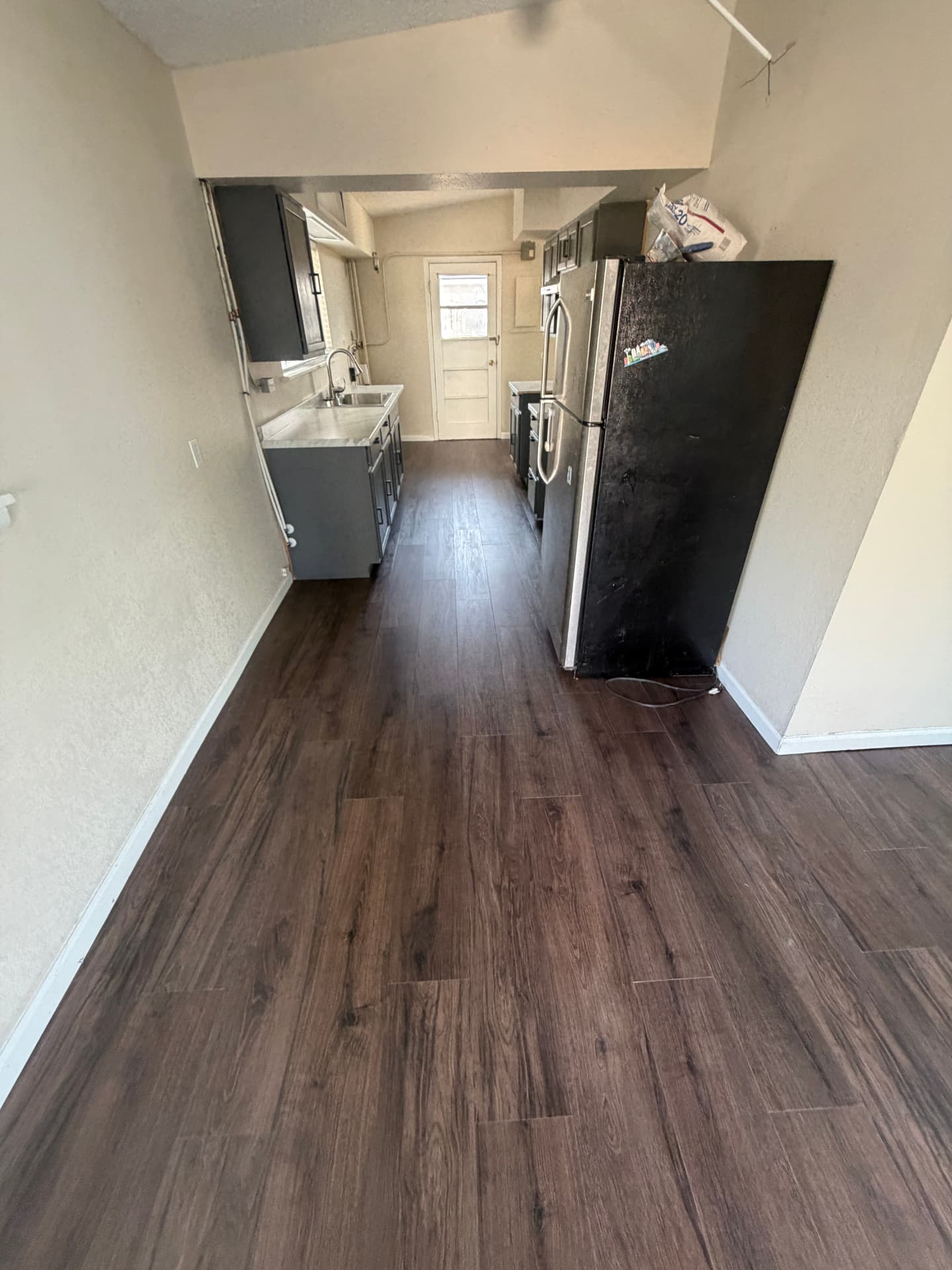 Open living and kitchen flooring renovation — After