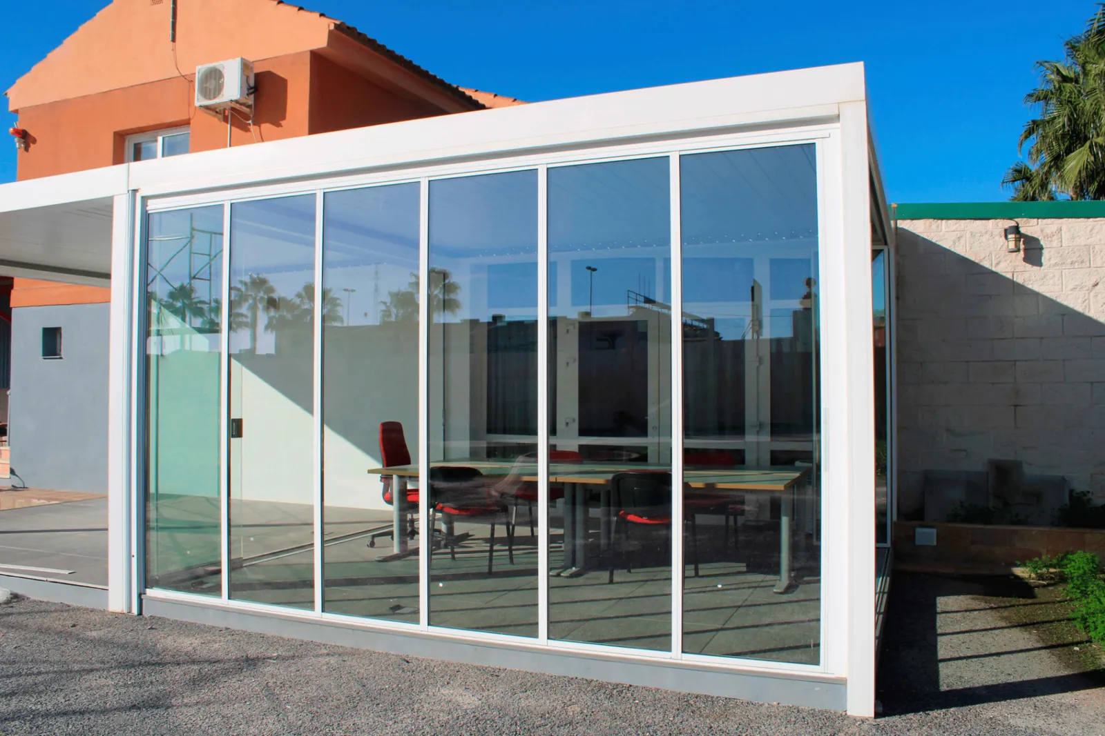 Frameless sliding glass office enclosure — Before