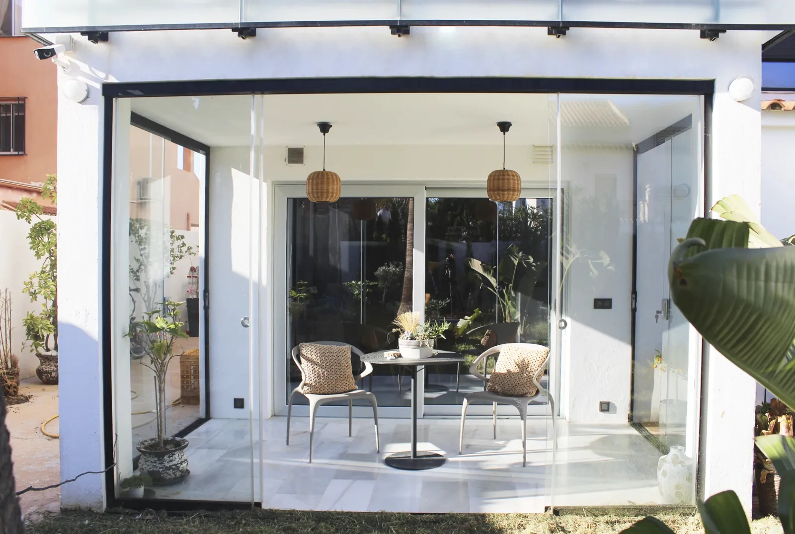 Frameless glass patio enclosure — After